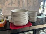 a lot of plates and cups on the table