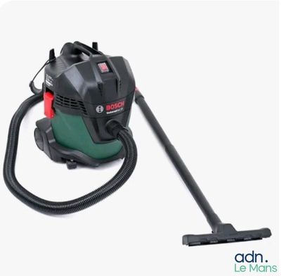 un aspirateur vert et noir sur fond blanc