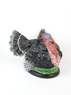 figurine of a turkey on a white background with a white background