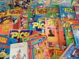 a pile of children ' s books on a table