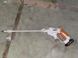 a toy gun on the ground next to a car