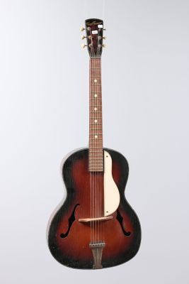 a close up of a guitar on a white background