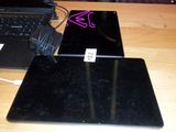 two laptops that are sitting on a table