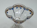 a glass bowl with a blue and gold design on it