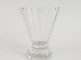 a clear glass vase sitting on a white surface