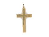 a small gold cross on a white background