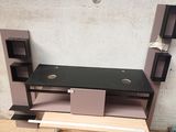 a computer desk with two shelves and a shelf on it