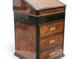 an image of a small wooden desk with drawers