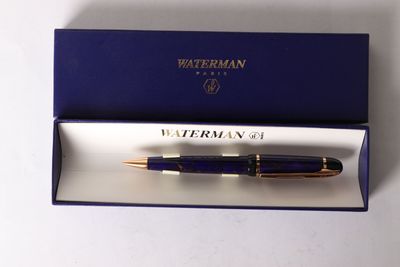 the pen is in a blue box with a gold trim