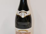 a bottle of wine that is sitting on a table