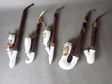 six pipe holders with different types of pipes hanging from them