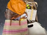 a bag and a purse sitting on the floor