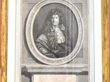 un vieux portrait gravé représentant un homme, dans un cadre doré