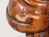 an image of a close up of a wooden sculpture of a person