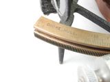 a close up of a metal object with a ruler on it