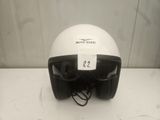 a white helmet with a tag on it on a table