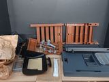 a desk with a laptop, keyboard, and other items on it