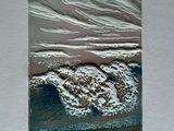 a picture of a picture of a wave coming in to the beach