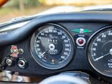 a close up of a car dashboard with a speedometer and gauges