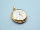 an image of a pocket watch on a table with a blue background