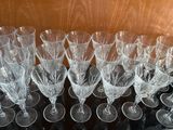 a lot of wine glasses sitting on a table