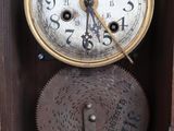 a clock that is sitting inside of a wooden box