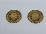 two gold coins, one of which has a crown and the other of which is a wreath