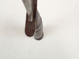 a close up of a metal object on a white surface