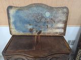an old wooden chest with a blue paint on it