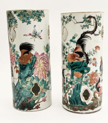 pair of chinese vases decorated with birds and flowers on a white background