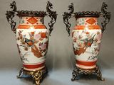 two vases that are sitting side by side on a table
