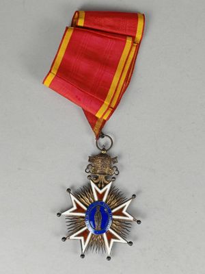 l'image d'une médaille avec une étoile sur une surface blanche