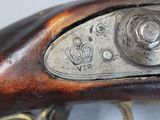 close up of a close up of a gun with a crown on it