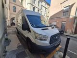 a white van that is parked on the side of the street