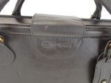 leather handbag with two handles and a zippered closure
