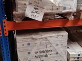 many boxes on the shelves in the warehouse