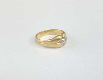 a gold ring with a diamond on top of it