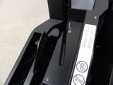 a close up of a printer with a button on the side of it