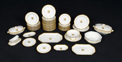 a lot of white and gold plates and bowls
