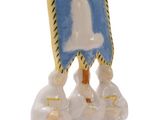 a figurine of a group of people holding a flag