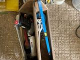 a wooden box with tools in it sitting on the floor
