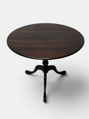 an image of a round table with a wooden top and black legs