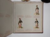 an open book with pictures of military uniforms on it