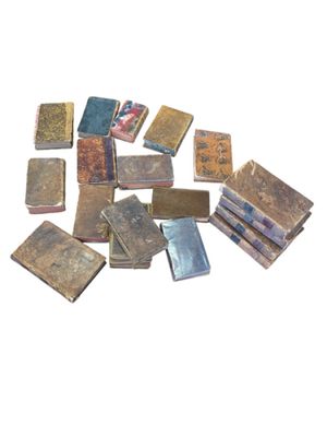 a pile of old books sitting on top of each other