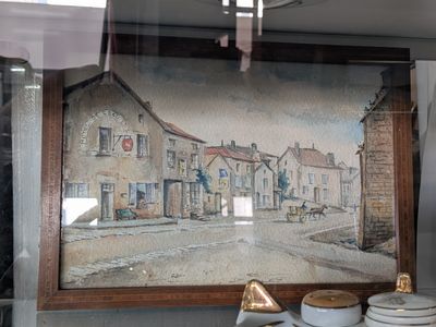 a picture of a painting on the wall of a restaurant