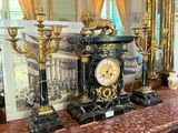 a picture of a clock on a table in a room