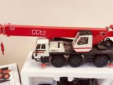 a toy truck with a crane on top of it