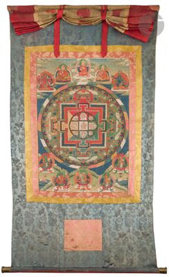 a painting of a buddhist wheel hanging on a wall