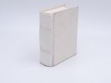 an image of a small white book on a white surface