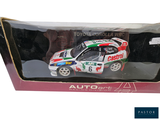 a toy car that is in a box on the table